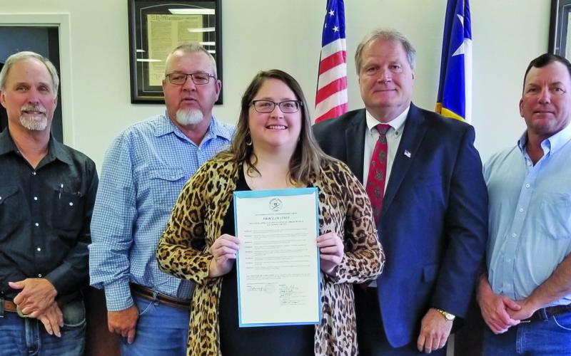 Sentinel Photo/Mike Reddell Commissioners Court approved a proclamation recognizing April 23 - 29, as National Library Week at the court’s meeting Monday, April 17. Shown are, from left: Precinct 1 Commissioner Bubba Cook, Precinct 4 Commissioner Bubba Frick, Bay City Library Director Samantha Denbow, County Judge Bobby Seiferman, and Precinct 2 Commissioner Mike Estlinbaum.