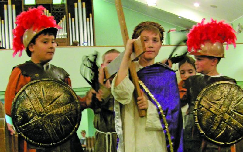 Holy Cross Catholic School photo On holy Thursday, Holy Cross Catholic School's 4th and 5th graders presented The Stations of the Cross, a 14-step Catholic devotion that commemorates Jesus Christ's last day on Earth as a man. The Holy Cross Catholic School Choir performed during this beautiful re-enactment and other students narrated.