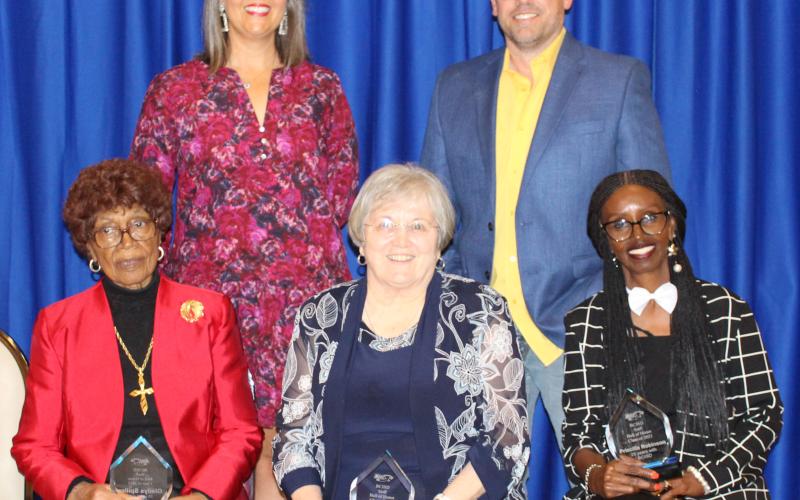 Sentinel Photo/Jessica Shepard Gladys Beller Spiller, the late Otha D. Gray, Jr., and Priscilla Robinson were honored for their commitment to Bay City ISD and their service as educators at BCISD's annual Employee Appreciation Banquet last Thursday. Gray was represented by his wife Jeanne, center, for the award, with Bay City ISD Trustee President Jill Westmoreland and Trustee Trent Tinnin, back.