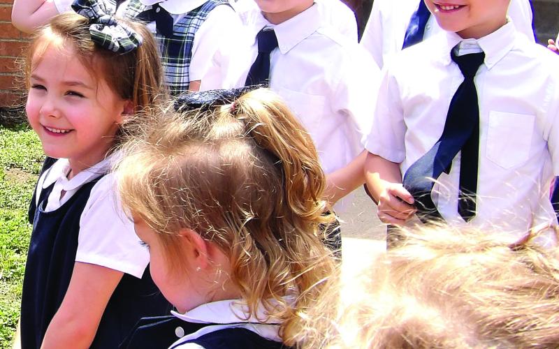 Courtesy photo It was Butterfly Release Day at Holy Cross Catholic School recently. The last month has been enjoyable watching the students learn about the growth cycle of the Painted Lady butterfly. Many were excited, and some were saddened, as their pollinator friends flew off into the blue sky. We had one butterfly hesitate for a few moments to say good-bye.