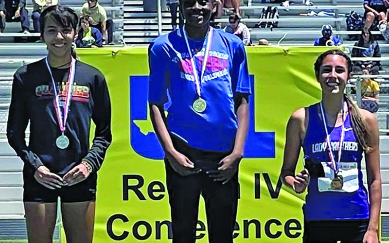 Contributed photo Tidehaven’s Mary Johnson, center, placed 1st in the high jump at regionals and will advance to state.