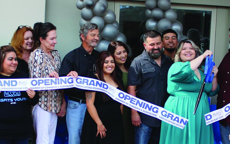 Sentinel Photo/Jessica Shepard Infinite Fades had its grand opening ribbon-cutting ceremony Monday, June 5. Family and friends joined Infinite Fades owner Crystal Charles for the ceremony. The cut and style barbershopshop is located at 1621 6th St., Unit B in Bay City.
