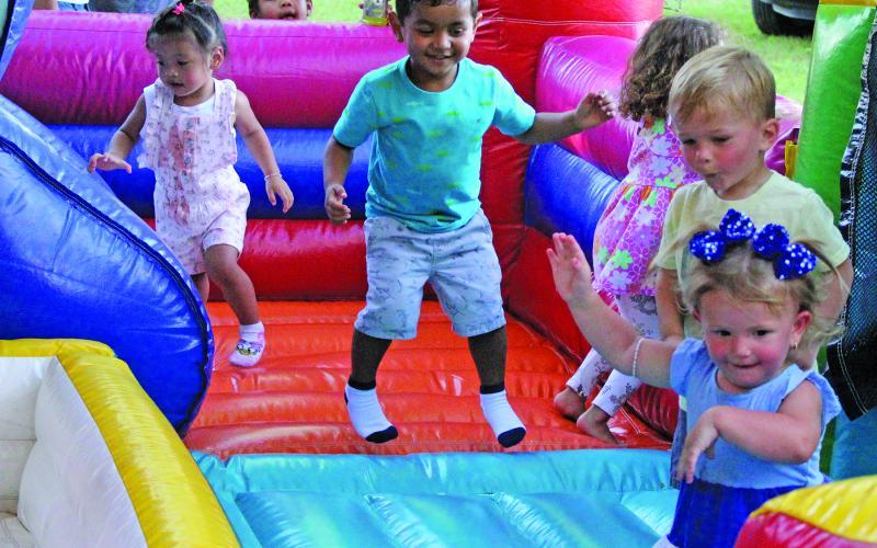 Sentinel Photo/Jessica Shepard This group of youngsters are delighted with the bouncy house that was part of the City of Bay City’s Independence Day celebration that featured food trucks, music, a new rock climbing activity and, of course, fireworks.