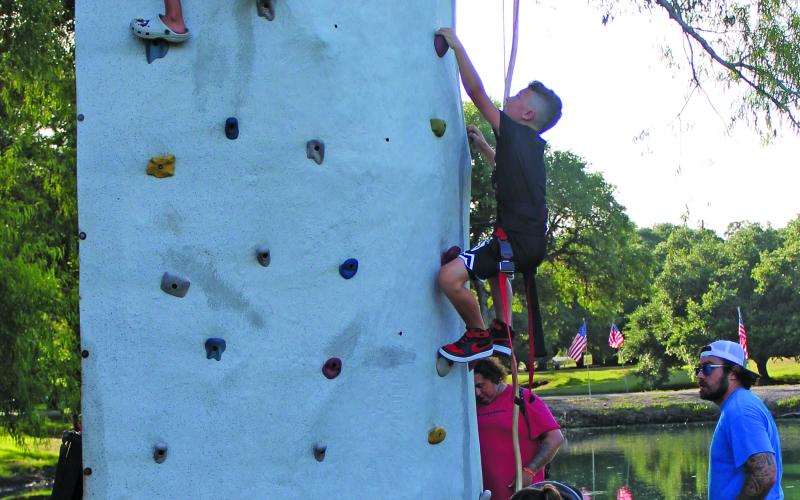 Sentinel Photo/Jessica Shepard Bay City Parks &amp; Recreation Department's annual "Freedom Fireworks" event was filled with games, food trucks, and musical entertainment for all at Le Tulle Park last week. New this year was a rock wall that featured children of all ages scaling to impressive heights and the longest line for any attraction on July 4th - save the annual fireworks display show later that night.