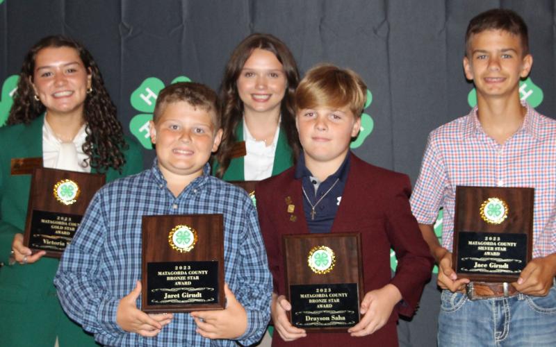Sentinel Photo/Jessica Shepard Bronze, Silver, and Gold Star awards were presented to outstanding 4-H club members in their given divisions during the annual 4-H banquet Thursday, July 20. Those recipients are: back row from left: Victoria Sliva and Ansley Kubecka; front row, from left, Jeret Girndt, Drayson Saha and Jace Girndt. Kacey Kubecka is not pictured. See Page 8 for more 4-H award winners.