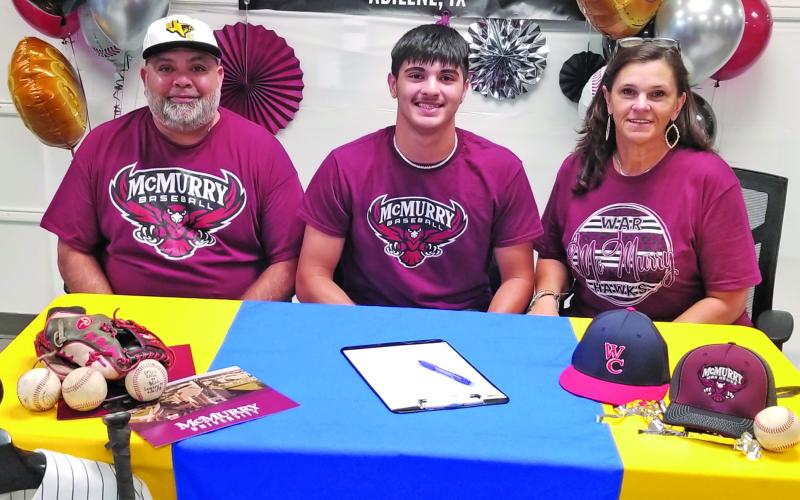 Sentinel Photo/Mike Reddell Fomer Bay City Blackcat pitcher David Perez, flanked by his parents, Vincent Perez, Sr. and Kelli Briggs, signed with McMurry University to play baseball Monday at Bay City High School. Perez was a standout in both baseball and football at BCHS.