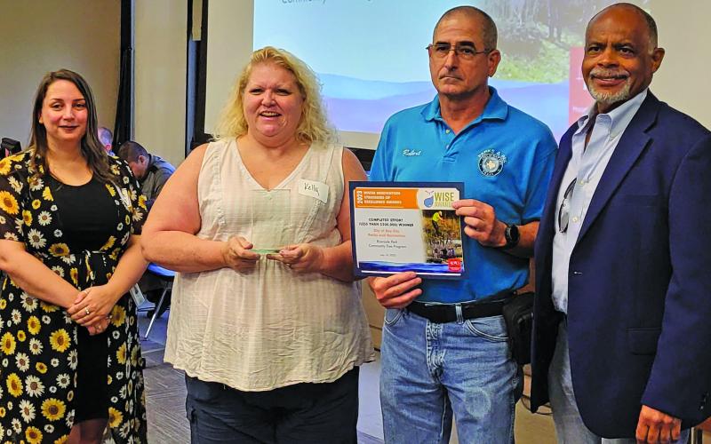 Contributed photo City staff show off H-GAC Water Wise Award for Riverside Park Community Tree Give Away.