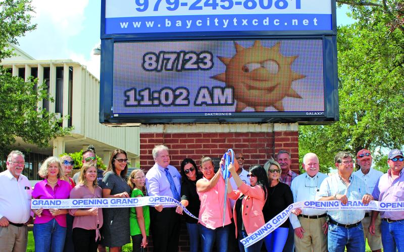 Sentinel Photo/Jessica Shepard BCCDC and Main Street Program partnered with the Bay City Chamber of Commerce &amp; Agriculture to celebrate the rehabilitation of its digital sign with a ribbon-cutting Monday morning at the courthouse. The newly rehabilitated sign has been a BCCDC project goal since January of this year.