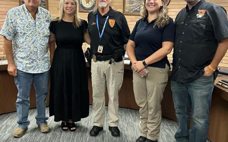 Contributed photo Captain Kim Kunz (second from right) was sworn in as a Van Vleck ISD Police Officer by VVISD Chief of Police Fred Wesselski (center). Also shown, from left, are: Tony Kucera, VVISD trustee president; Christi Dement, superintendent; and, far right, trustee Casey Kile.