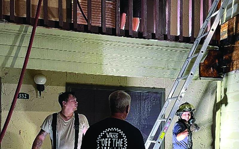 Dan Shook photo Firefighters work Palm Village Fire Aug. 1
