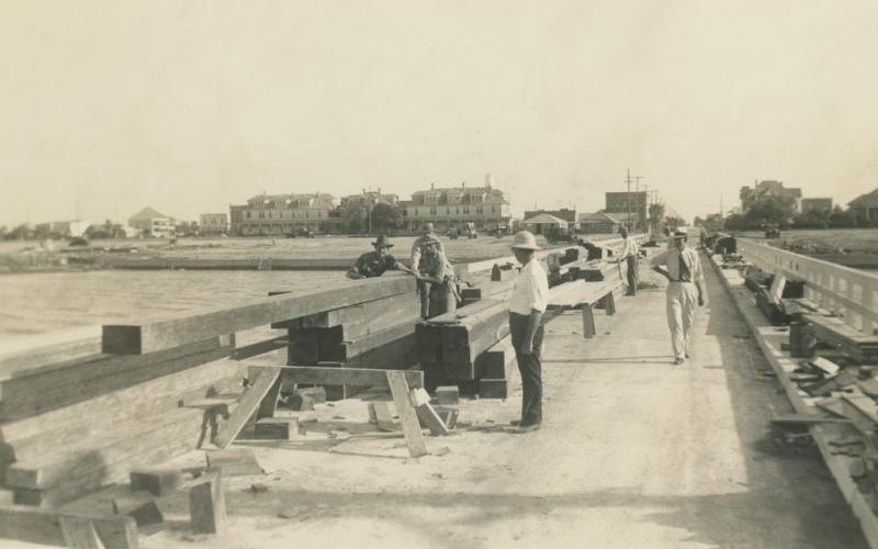 Photo courtesy of City by the Sea Museum Men working on the pavilion pier with the seawall being constructed in the background, c. 1935.