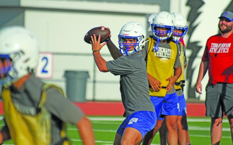 Anna Hernandez photo Tidehaven sophomore quarterback Kale Russell looks for a receiver in the Tiders workout last week. SB Live recently ranked Russell among the “South Texas 20 Best Quarterbacks.”