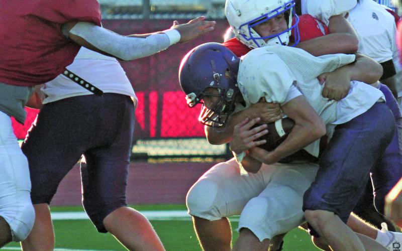 Anna Hernandez photo Tidehaven defenders make a stop on a Shiner running play at last Friday’s scrimmage.