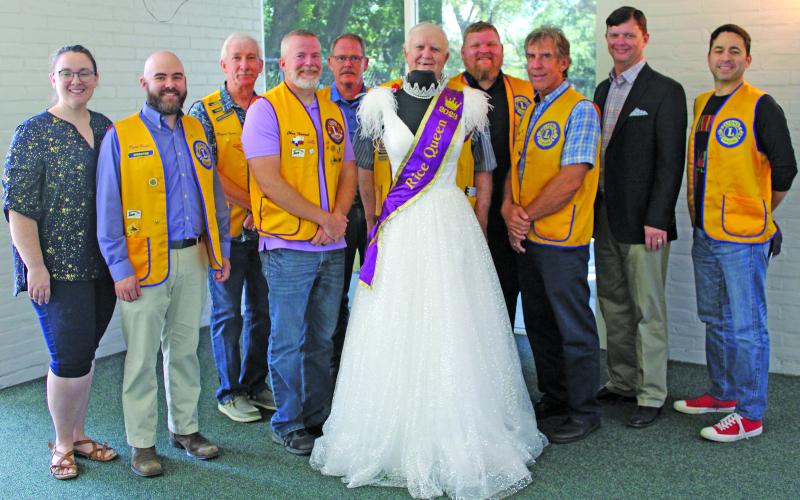 Sentinel Photo/Jessica Shepard Bay City Lions Club members pose with this year’s Rice Festival Queen dress, sponsored by OQ Chemicals on Sept. 8. From left are Pageant Director Rachel Ricks, Pageant Chairman Ryan Ricks, Mike Finster, Chris Hadash, Dan Shook, Doc Campbell, Chad Craft, David Krenek, Eric Wright from OQ and Ben Flores. The dress and crown are from "New Beginnings" in El Campo and also feature jewelry from Green Bros. Jewelers.