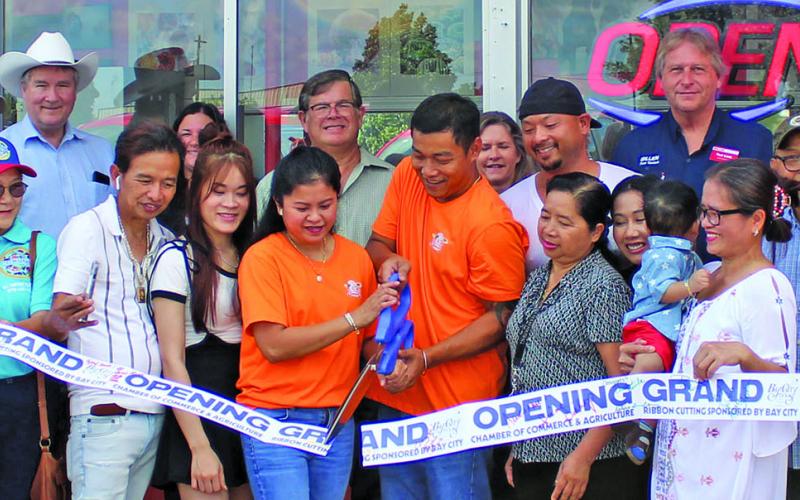 Sentinel Photo/Jessica Shepard Master Glazed Donuts partnered with the Bay City Chamber of Commerce &amp; Agriculture to celebrate its grand opening with a ribbon-cutting ceremony Wednesday, Sept. 6 at the shop. The donut shop is located at 4206 7th St. in Bay City.