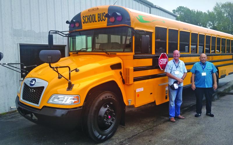 Contributed photo Matagorda ISD bus driver Jerry Richardson, left, and volunteer David Marchbanks, right, attend specialized training for the district's incoming electric buses recently. The electric buses are scheduled to arrive sometime in September.