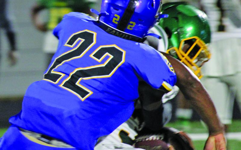 Sentinel Photo/Mike Reddell Sophomore James Copeland (22) makes a stop on a Worthing running back.