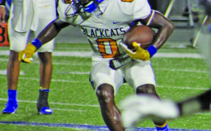 Sentinel Photo/Mike Reddell Bay City junior running back Jada Andrews (0) looks for an opening against Edna last Friday.
