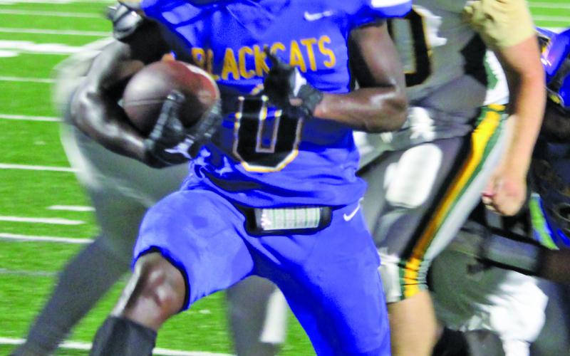 Sentinel Photo/Mike Reddell Bay City junior running back Jada Andrews scores - one of his three touchdowns. Andrews had 198 yards rushing.