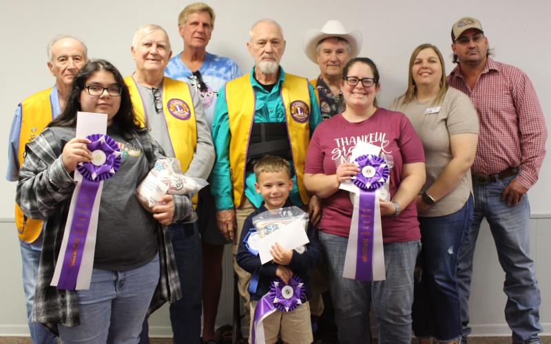 Winners of the annual Rice Dish Round-up contest were awarded blue ribbons on Tuesday, Oct. 17. Grand Champions, above, received purple ribbons along with a cash award and bag of rice. From front left are Angeleigh Gonzales, grades 9-12; George McHugh, grades 1-5; and Ashley Brewer, adult division. Not pictured is Jace Grindt, grades 6-8.