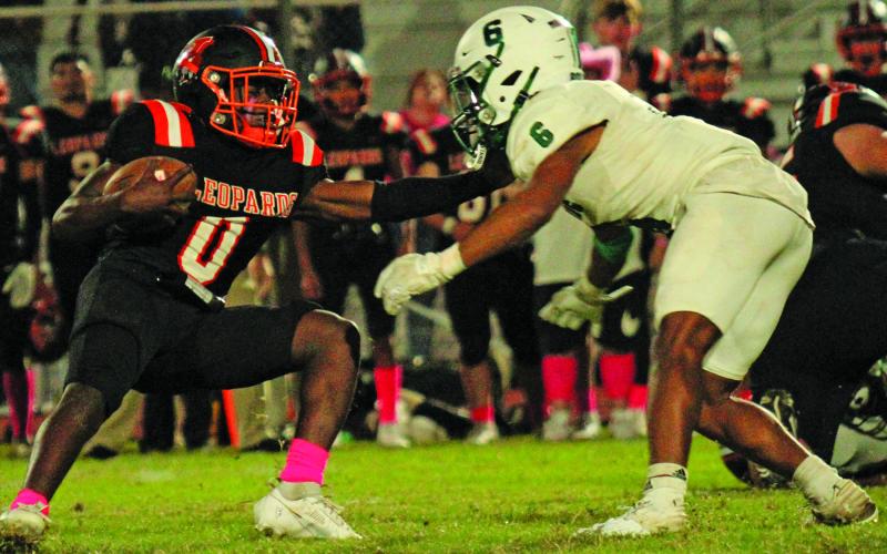 Anna Hernandez Junior Van Vleck running back Corey Austin (0) tries to move past a Boling defender. Austin had a 39-yard touchdown run.