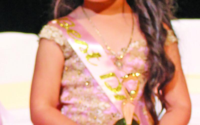 Sentinel Photo/Jessica Shepard Penelope Garcia won "Best Dress" during the Little Miss &amp; Mister Rice Festival pageant on Saturday.