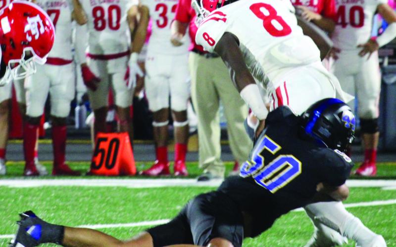 Sentinel Photo/Mike Reddell Blackcat sophomore defensive tackle Elijah Suarez (50) brings down an El Campo runner.