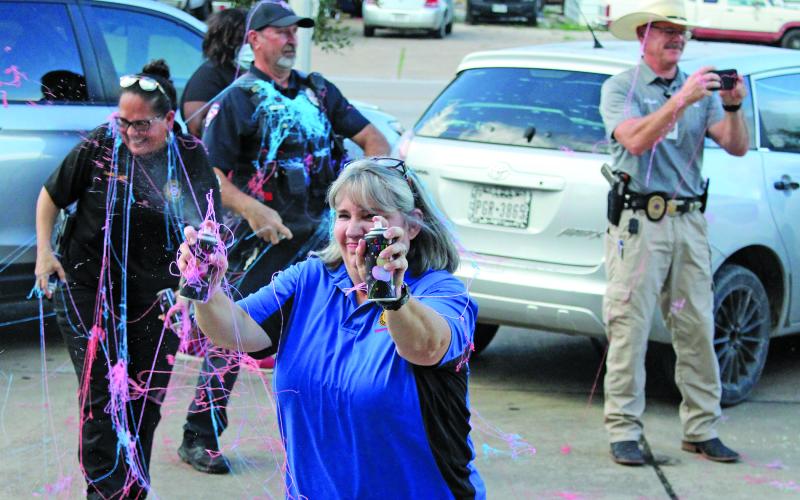 Sentinel photo/Jessica Shepard Bay City Police Department personnel faced off against each other and neighborhood children during Bay City Public Library's annual "National Night Out" kick-off Oct. 10. National Night Out is an annual community-building campaign that promotes police-community partnerships and neighborhood camaraderie.