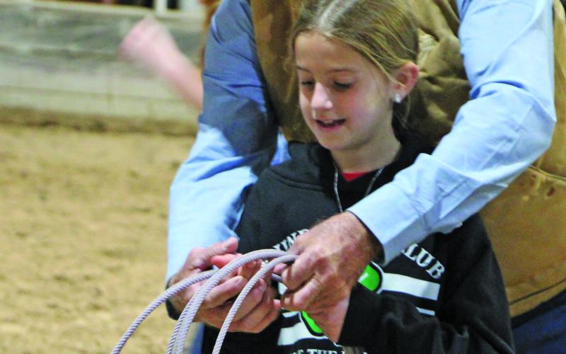 Local rancher Ray Culver demonstrated the fundamentals of roping to county fourth graders as part of Texas Farm Bureau's "Ag Field Day" last Thursday. Culvers hands-on class was one of several highlighting agriculture in Matagorda County Sentinel Photo/Mike Reddell