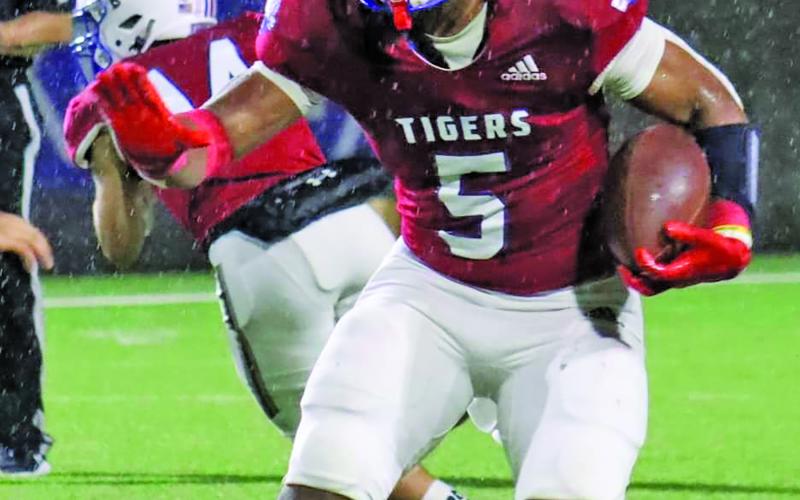 LeDarion Stone/Live in the Moment Photography Tidehaven running back Joseph Dodds finds room to run.