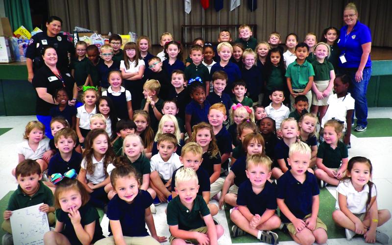 Contributed photo Ginger Iovanna and Lillie Norris with the Bay City Municipal Court visited Holy Cross Catholic School recently, along with Bay City Police Officer Tomasiato. The three ladies taught HCCS students about stranger danger, seatbelt safety, car seat safety, bike safety, and how not to ride in a vehicle when someone is under the influence.