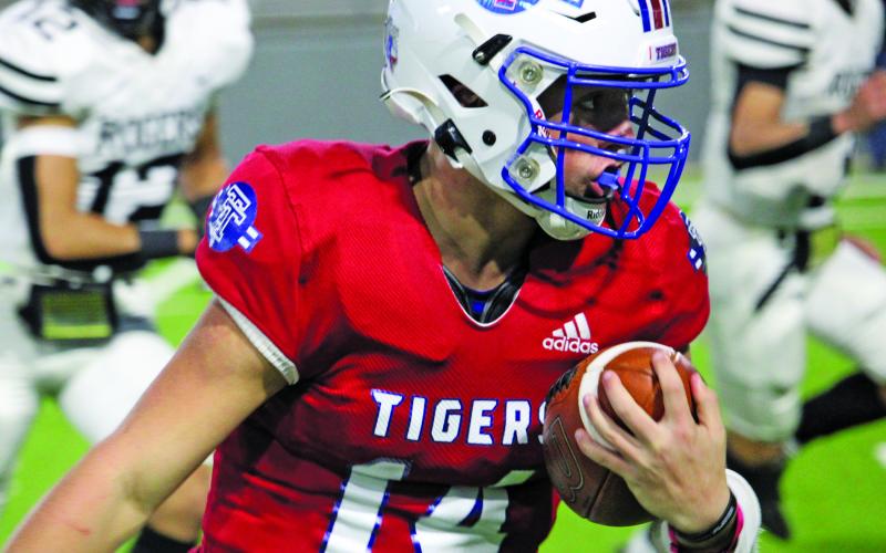 Sentinel Photo/Mike Reddell Tidehaven quarterback Kale Russell picks up yards en route to a 100-plus running game game.