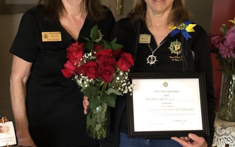 Jennifer Bishop (left) the 2022 Pilot Club Ambassador presented certificate and gifts to 2023 Ambassador, Loretta Griffin recently. Contributed photo