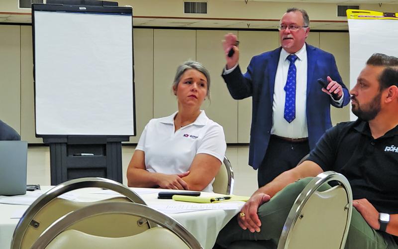 Sentinel Photo/Jessica Shepard Matagorda County Economic Development Corporation (MCEDC) Executive Director Mike Ferdinand, back right, led the Mid Coast Education &amp; Industrial Alliance meeting Oct. 24. Attendees discussed future partnerships and collaboration between Matagorda County school districts and various industrial employment needs.