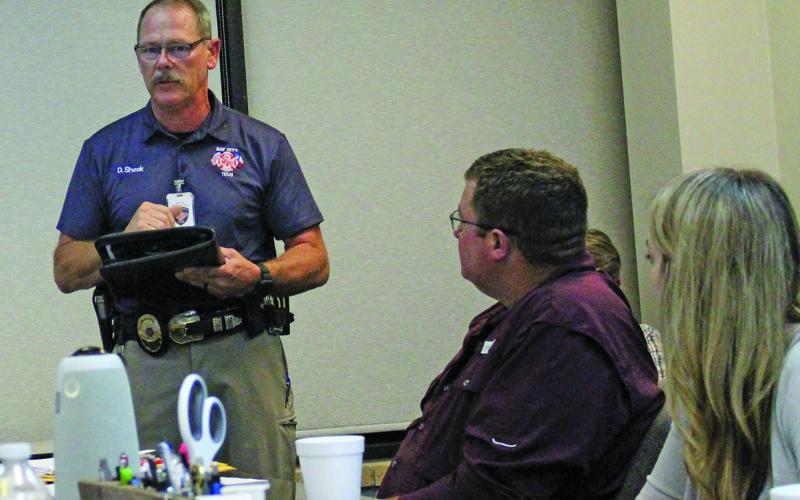 Sentinel Photo/Jessica Shepard Bay City Fire Marshal Dan Shook explains new pager system to the Port of Bay City Authority board, Nov. 9.