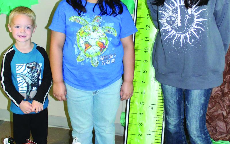 Sentinel Photo/Jessica Shepard This year's Sentinel Halloween Coloring Contest winners are Trevor Bloom, Lyric Garcia, and Jade Velazquez. Each winner received a blue ribbon for their artistry and a Halloween bucket full of treats.