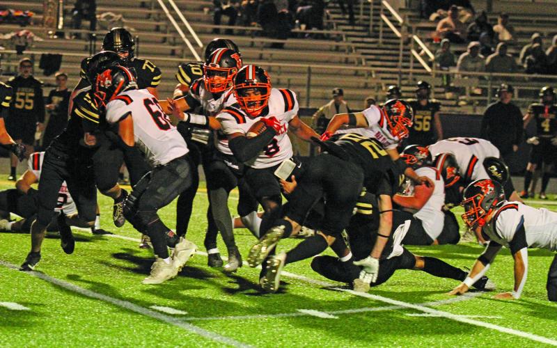 Anna Hernandez photo Van Vleck running back Keemar Allums (8) tries to break through the Rogers’ defense.