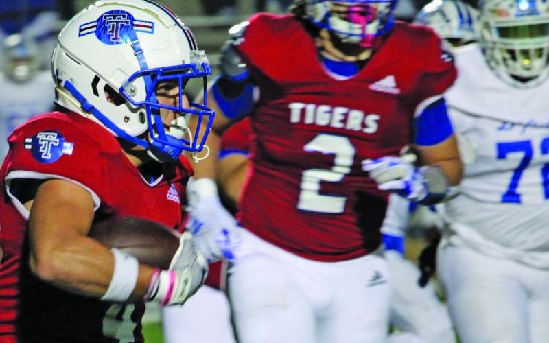 Sentinel Photo/Mike Reddell Tiger Boogie Galvan (4) finds an opening against Daingerfield.