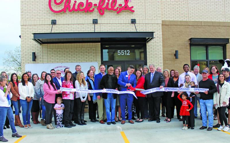 Sentinel Photo/Jessica Shepard Chick-fil-A Bay City celebrated its "Grand re-opening" with a ribbon-cutting ceremony on Wednesday, Nov. 29. The event recognized CFA Bay City Owner-Operator Nick Burnside along with his family, employees, and Matagorda Couny community leaders.