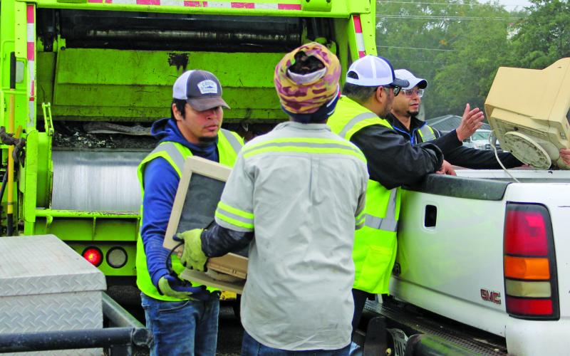 Sentinel Photo/Jessica Shepard GFL employees were on hand to off-load a variety of household items including outdated computer monitors, old mattresses, and chairs during the annual Bay City Spring Cleanup event, on Saturday, Dec. 8.