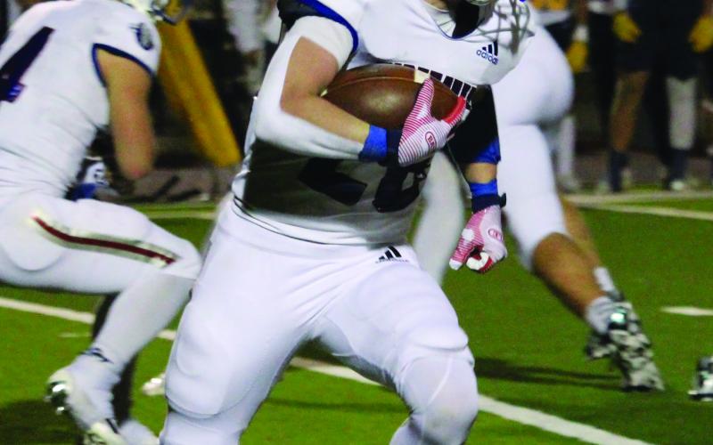 Sentinel Photo/Mike Reddell Tiger back Connor Claxton (28) picks up yards against Poth