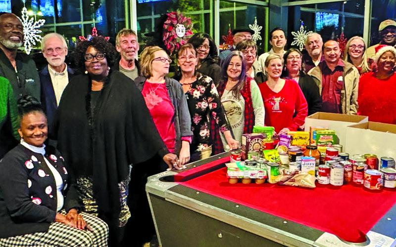 Contributed photo The Matagorda County Democratic Party gathered non-perishable food items at their December 11th holiday party. The food was donated to the Harvest House food pantry in Bay City.
