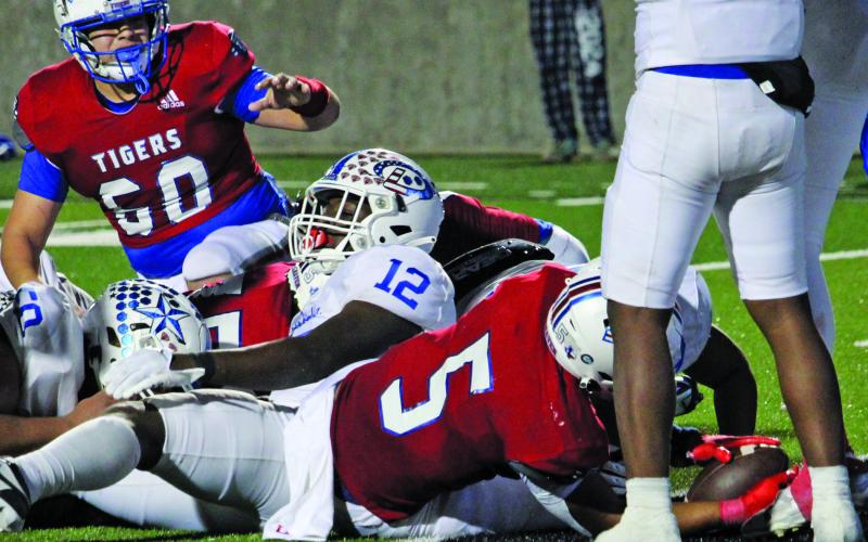 Sentinel Photo/Mike Reddell Tigers’ Joseph Dodds (5) puts the ball across goal line for the winning score.