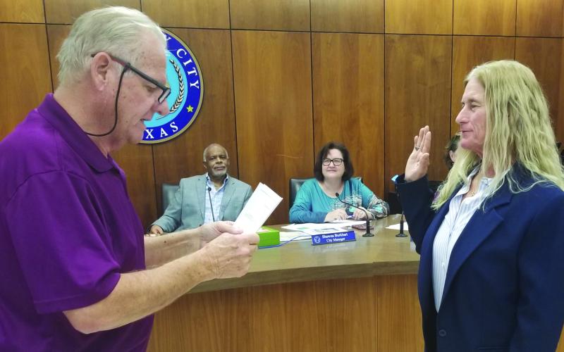 Precinct 2 Justice of the Peace Suzanne Sullivan was sworn in as Associate Municipal Court Judge by longtime Municipal Court Judge Mark Finlay at City Council's regular meeting Dec. 12. Finlay was honored at the meeting for his years of service. Sullivan will replace him as Associate Municipal Court Judge when Finlay retires in January. Sentinel Photo/Mike Reddell