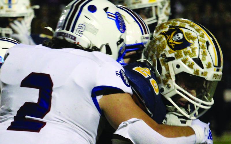 Sentinel Photo/Mike Reddell Tiger Jachen Duran (2) makes a key tackle on a Poth runner.