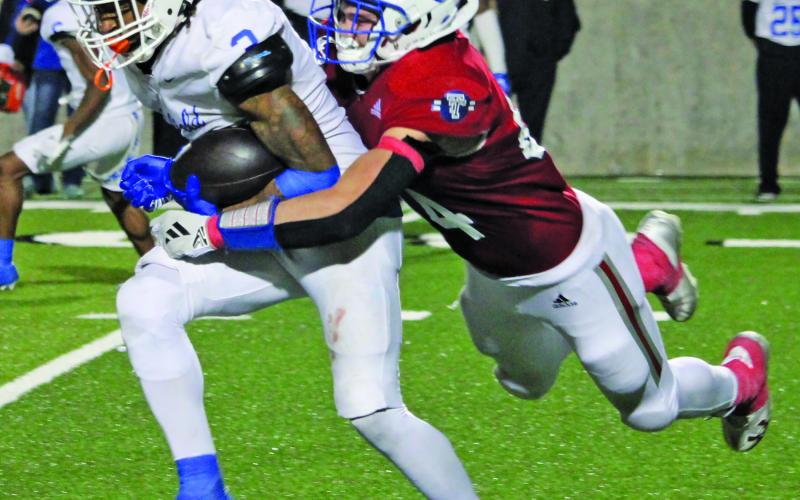 Sentinel Photo/Mike Reddell Tidehaven’s Justin Griffith (44) flying tackle stops a Daingerfield runner.