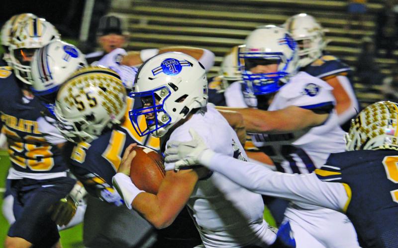 Sentinel Photo/Mike Reddell Tiger quarterback Kale Russell finds an opening in the Poth defense.