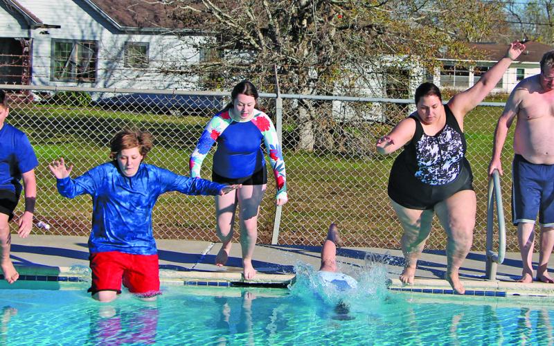 Sentinel Photo/Mike Reddell Eleven Bay City residents braved the cold temperatures on Saturday, Jan. 6, to take the 8th Annual  Polar Plunge at Hilliard Pool. The air temp was 48 degrees with a water temp of 58 degrees. Adults participating were: Jessica Mach, Ben Flores, Anna Flores, Erin Mach, and Terry Myren. Those under 18 were: Kai Castillo, Nadia Flores, Alexander Mach, Daphene Mach, Ian Wilson and Ivy Wilson.