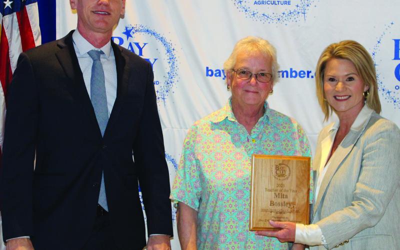 Holy Cross Catholic School Teacher of the Year Mita Bossley, with Matt Gullett and Danyel Biggerstaff.