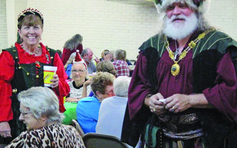 Sentinel Photo/Jessica Shepard At the Economic Action Committee of the Gulf Coast's annual "Christmas Luncheon" seniors and event volunteers got to meet a Hungarian Santa and Mrs. Claus on Wednesday, Dec. 20. The event featured a turkey lunch, door prizes, and fellowship infused with holiday spirit.